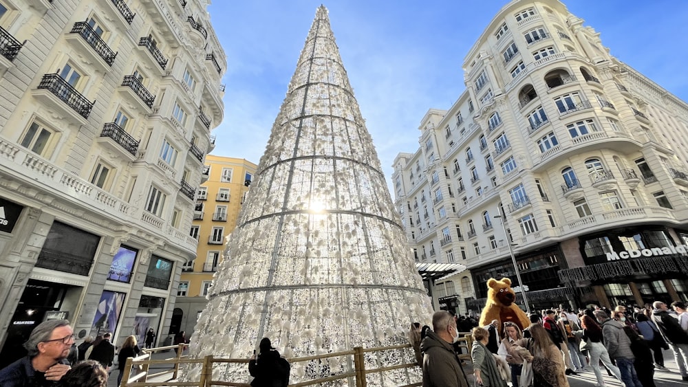 a giant christmas tree in the middle of a city