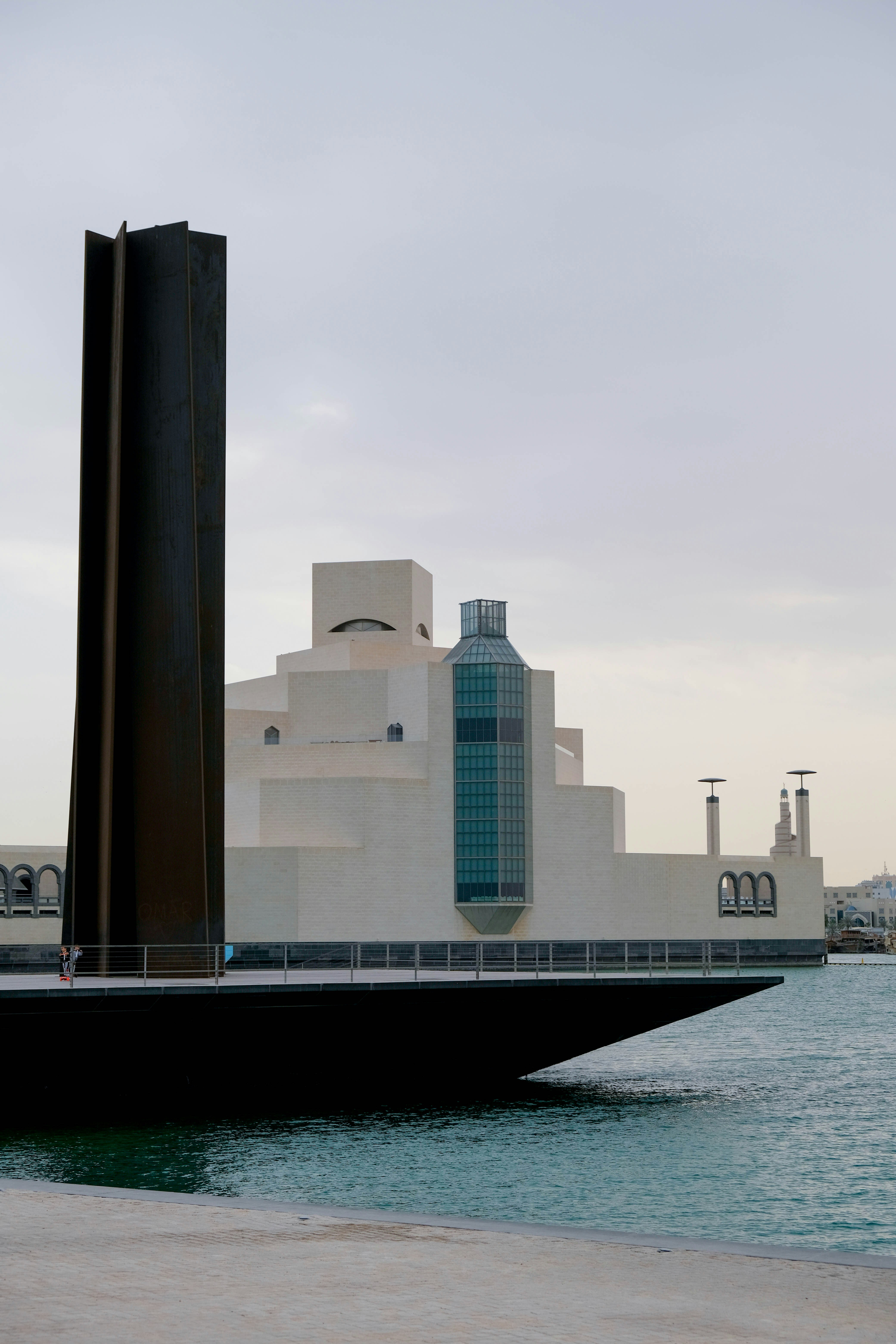 a large building sitting next to a body of water