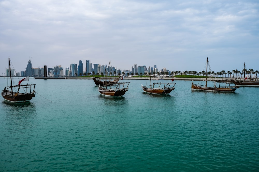 a group of boats floating on top of a large body of water