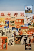 A collage of vintage and retro posters featuring various themes. The posters include advertisements with bold, colorful graphics and characters from popular media. Some posters have Chinese text, while others depict recognizable characters from cartoons and movies. The colors are vibrant, with a mix of warm and cool tones.