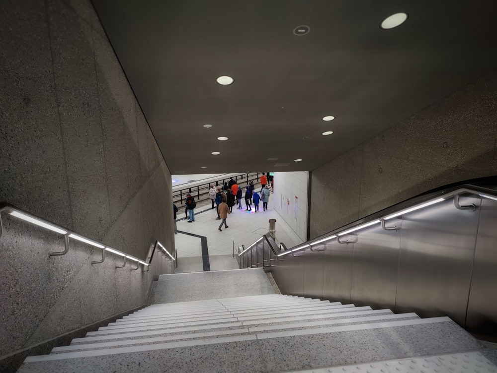 a group of people walking down a set of stairs