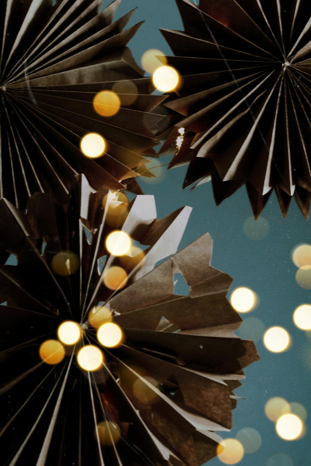 a close up of a mirror with lights in the background