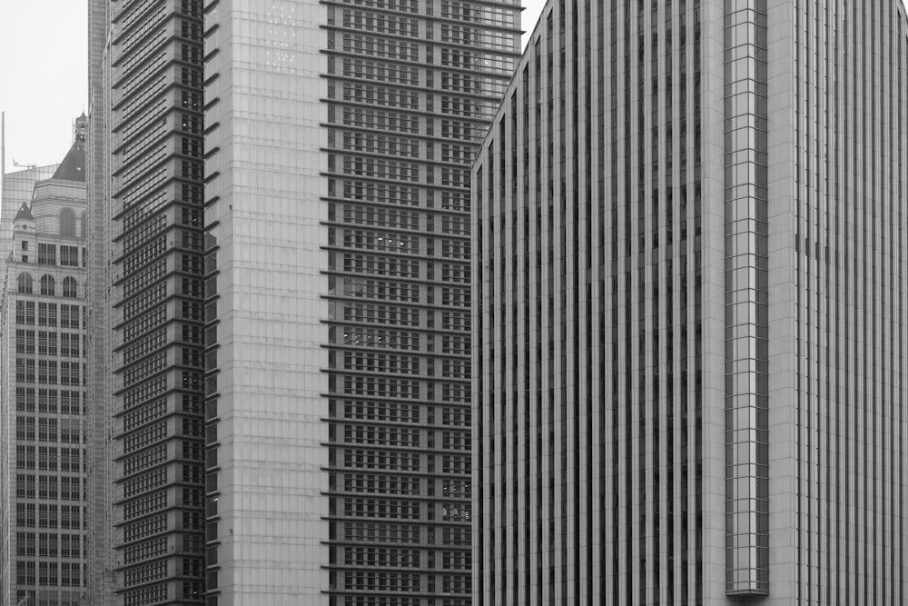 a black and white photo of tall buildings