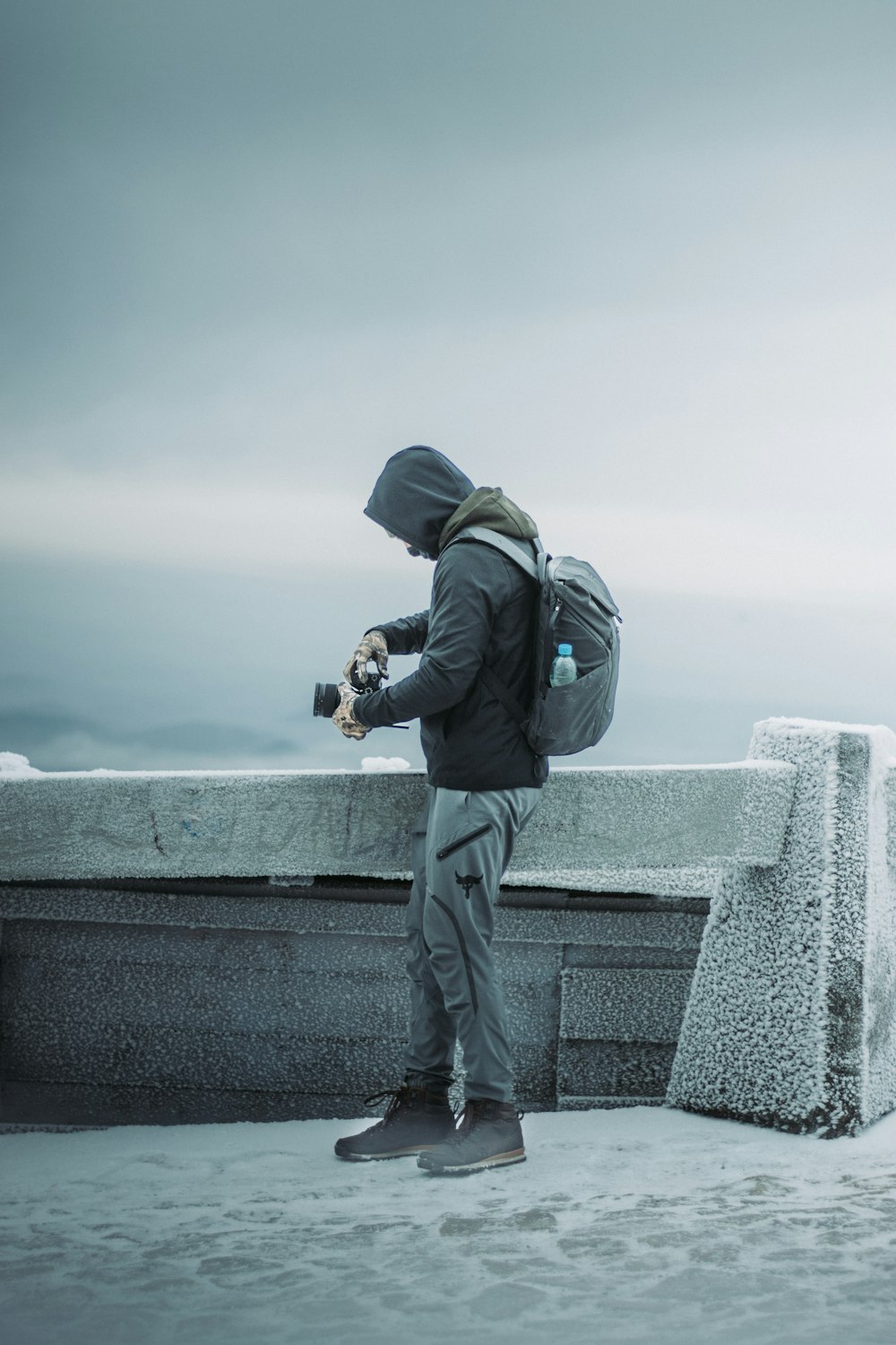 a person with a backpack and a camera