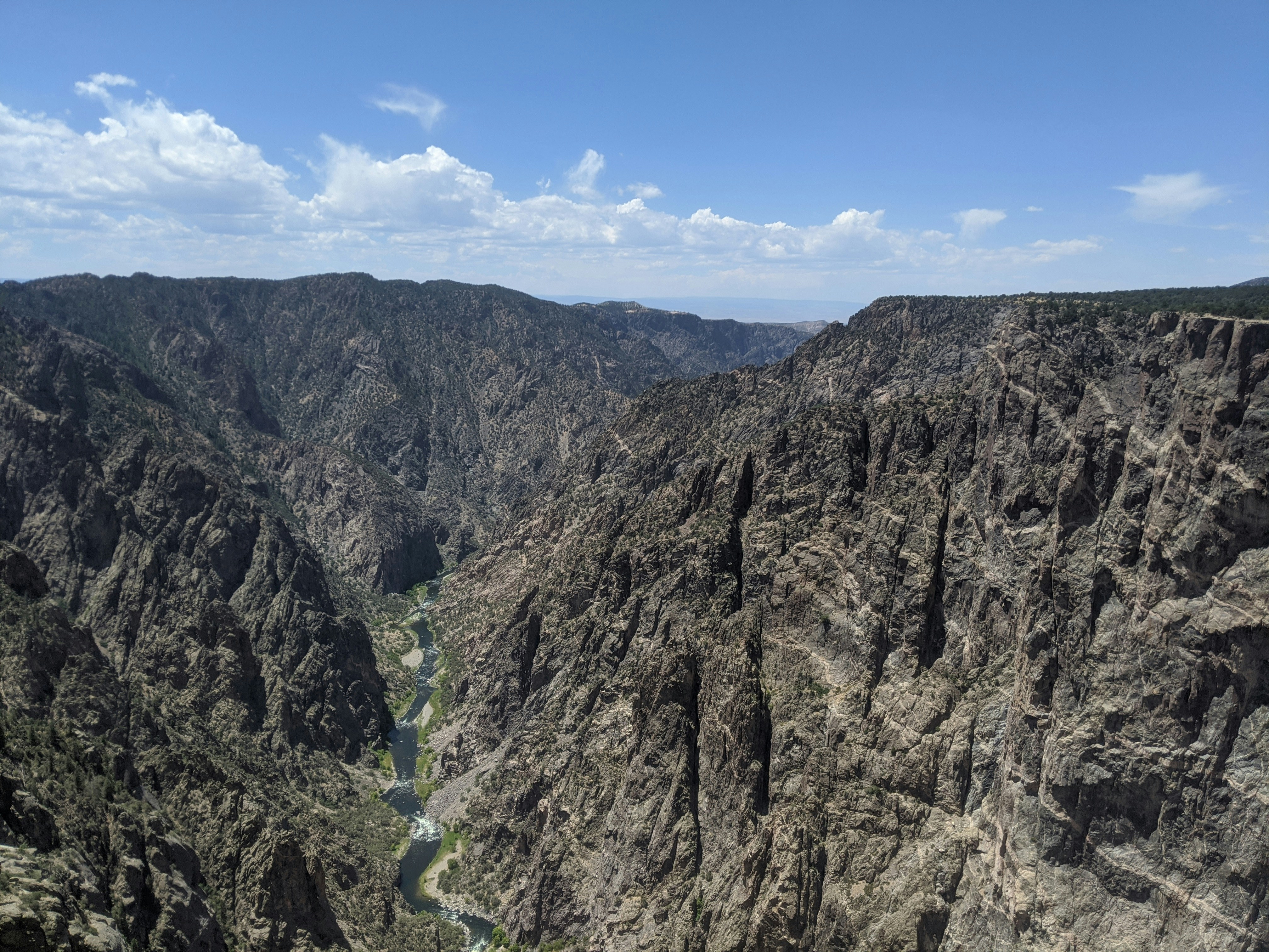 a view of a canyon with a river running through it, 