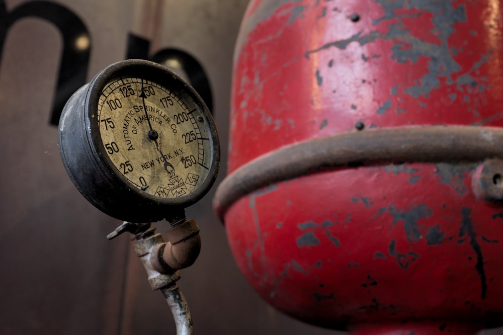 a close up of a pressure gauge on a pole