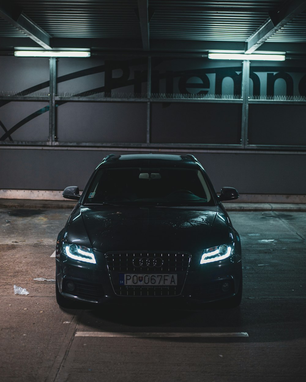 a car parked in a parking lot at night