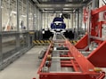 a car being built in a large factory