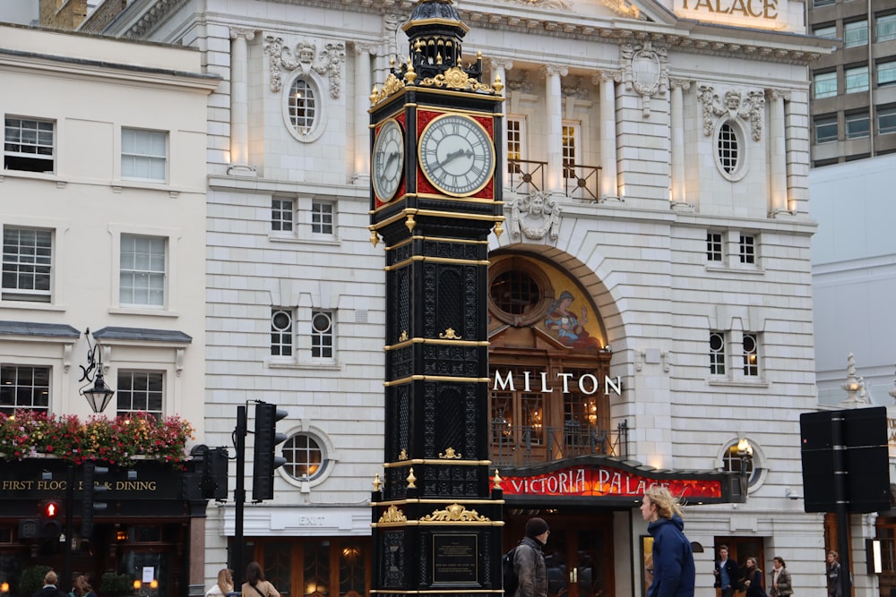 a tall clock tower sitting in front of a building