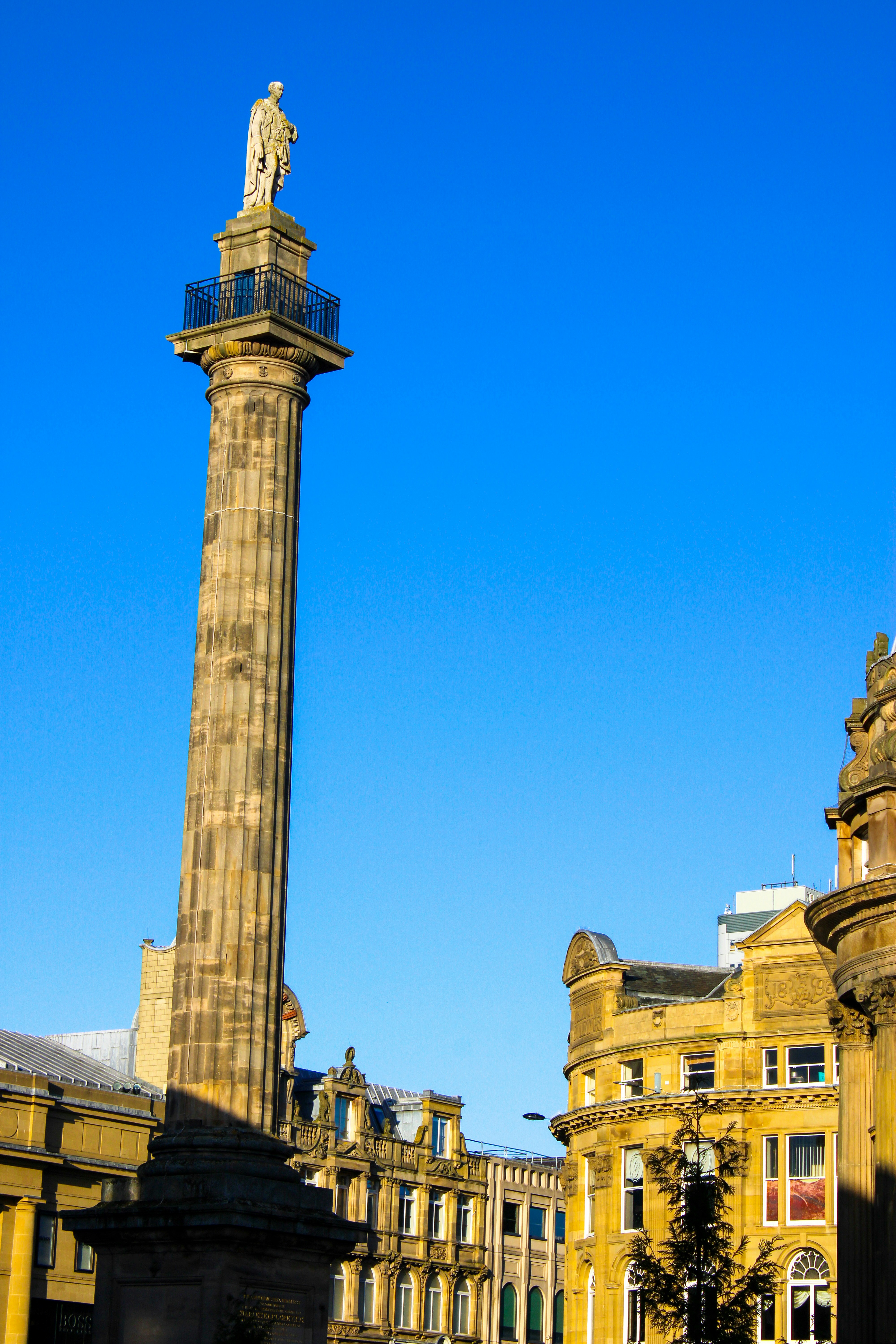 a tall clock tower sitting in the middle of a city