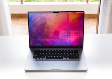 A modern laptop adorned with a colorful skin.