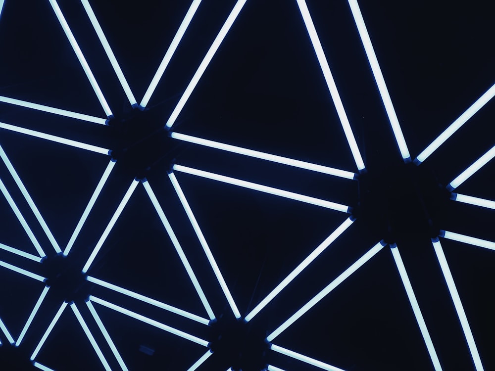 a close up of a ceiling with a blue light