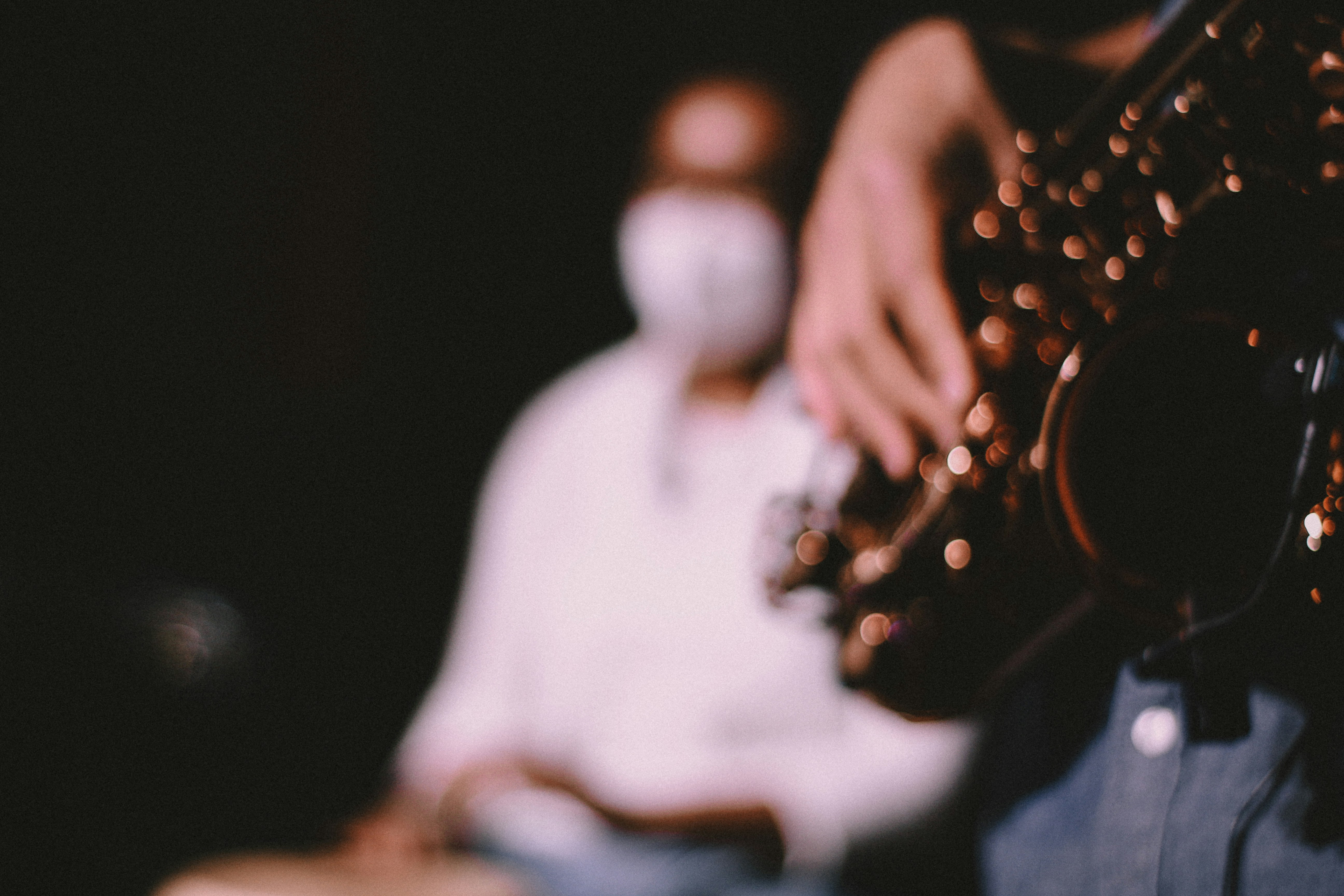 a close up of a person playing a saxophone
