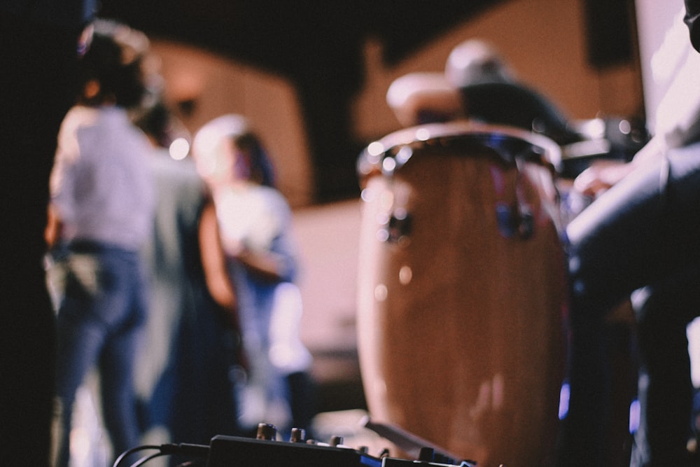 a group of people standing around a drum