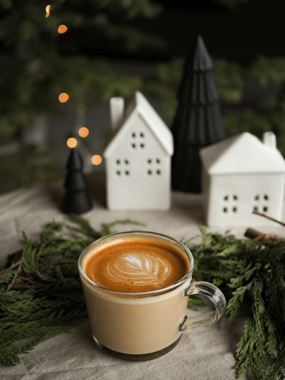 a cup of coffee sitting on top of a table