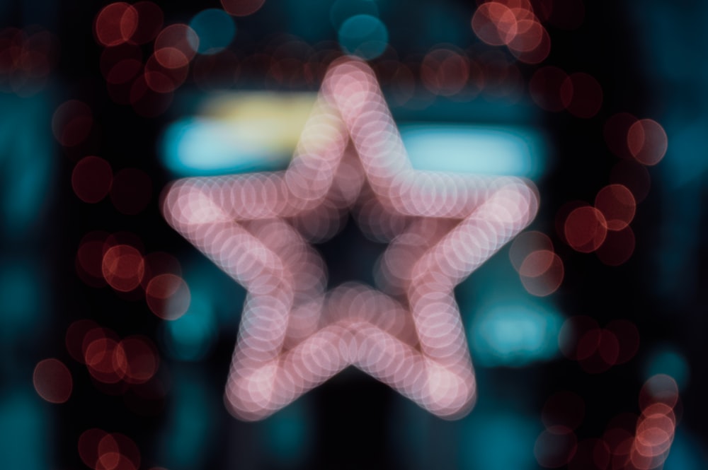 a blurry image of a pink star