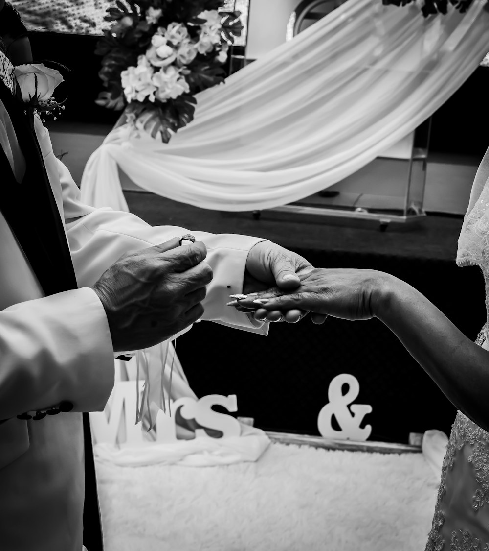 a bride and groom exchanging vows at their wedding