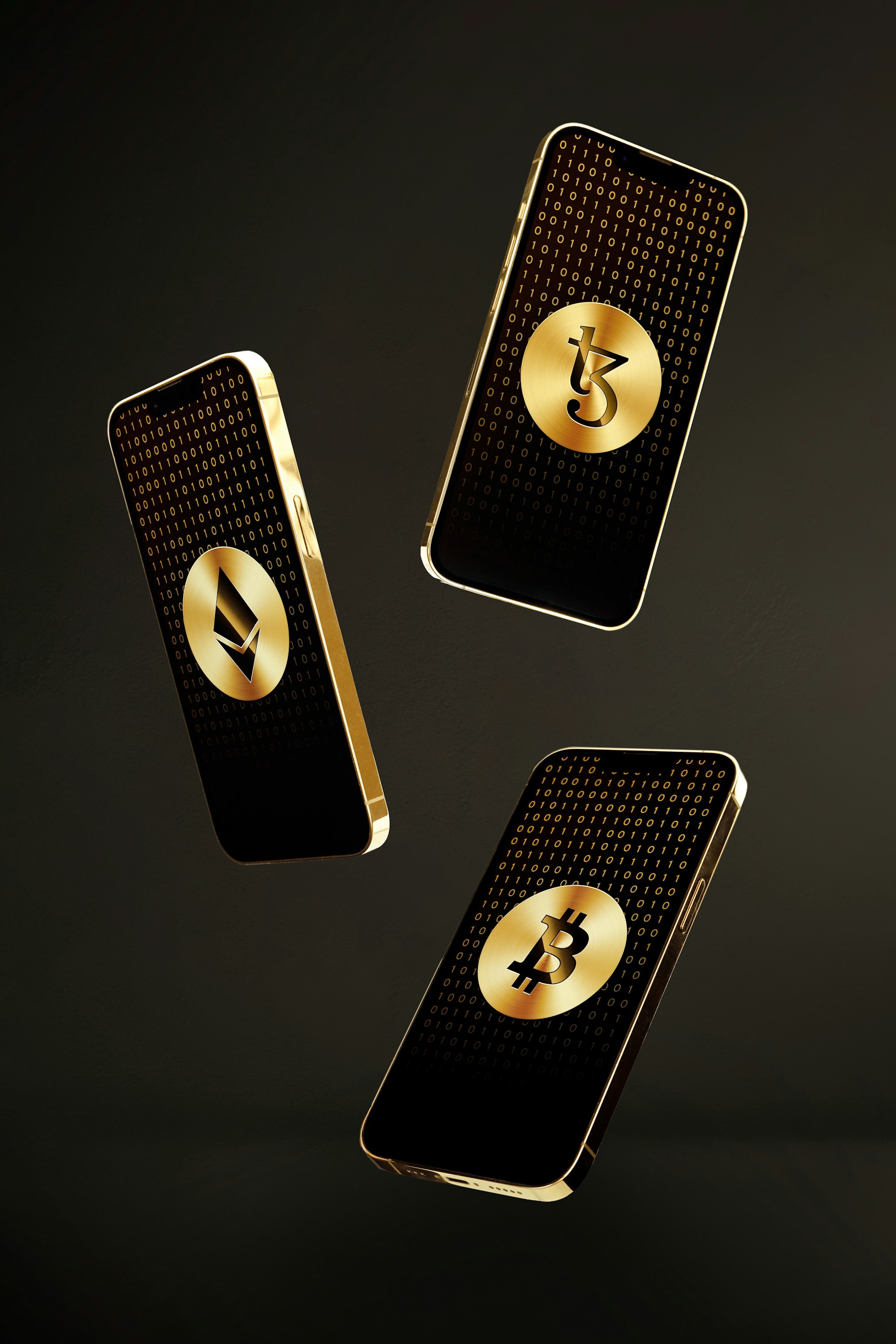 Gold iPhones with gold Ethereum, Tezos and Bitcoin coins