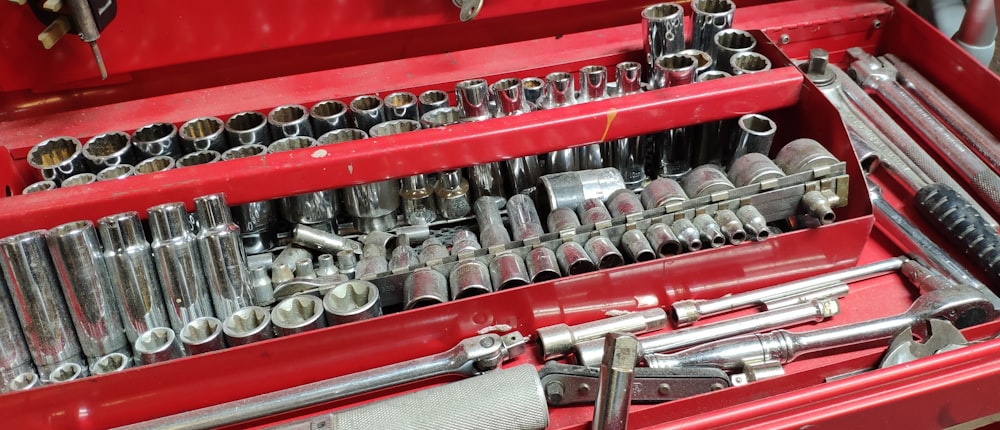 a red toolbox filled with lots of tools