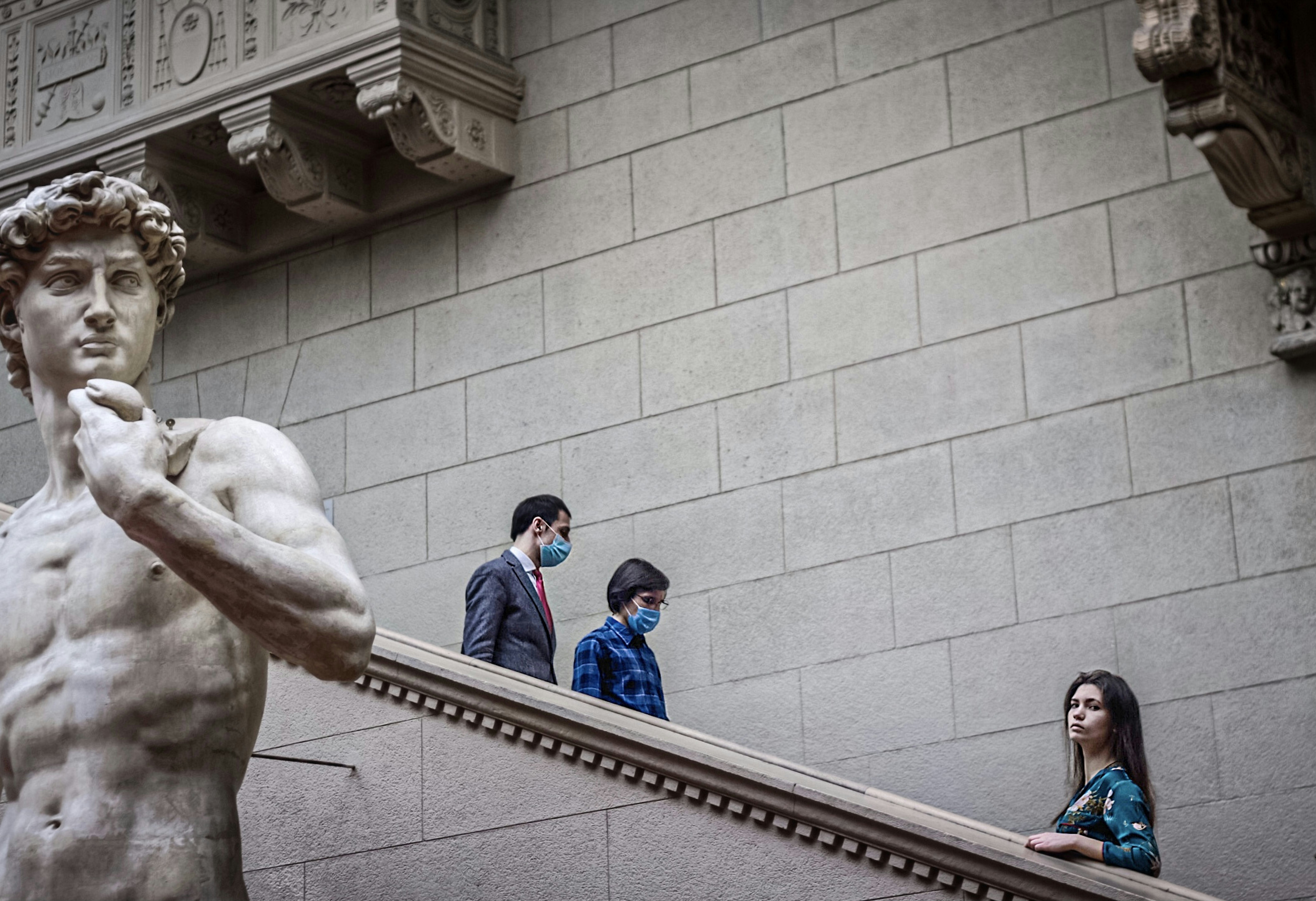 a statue of a man standing next to a woman