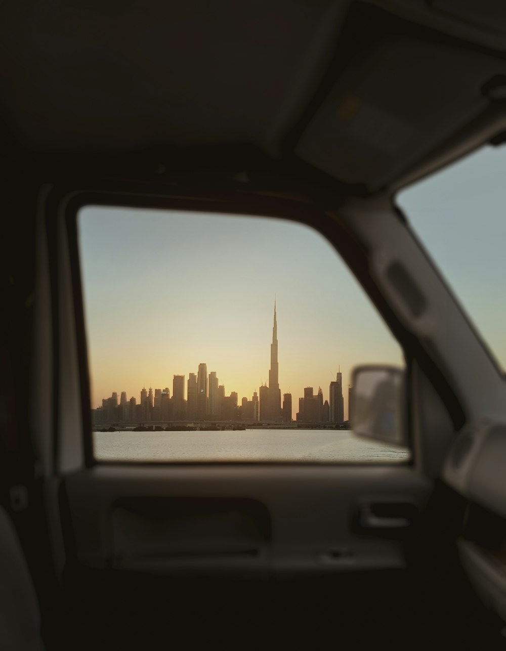 a view of a city from inside a vehicle