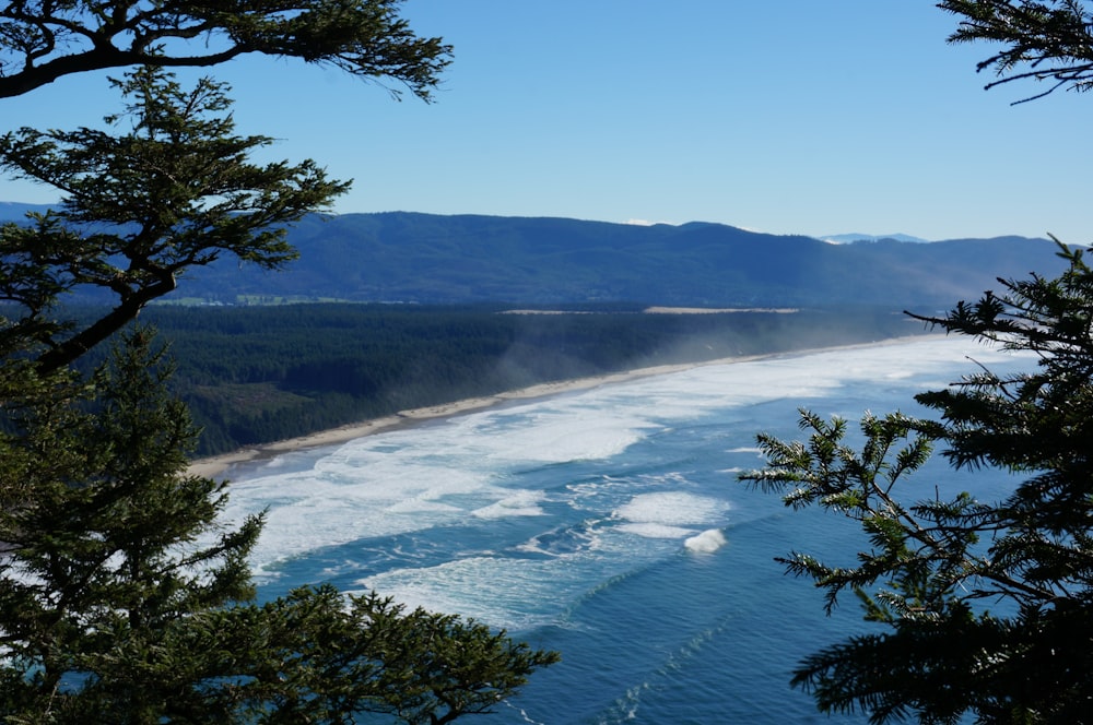 a view of a body of water with mountains in the background