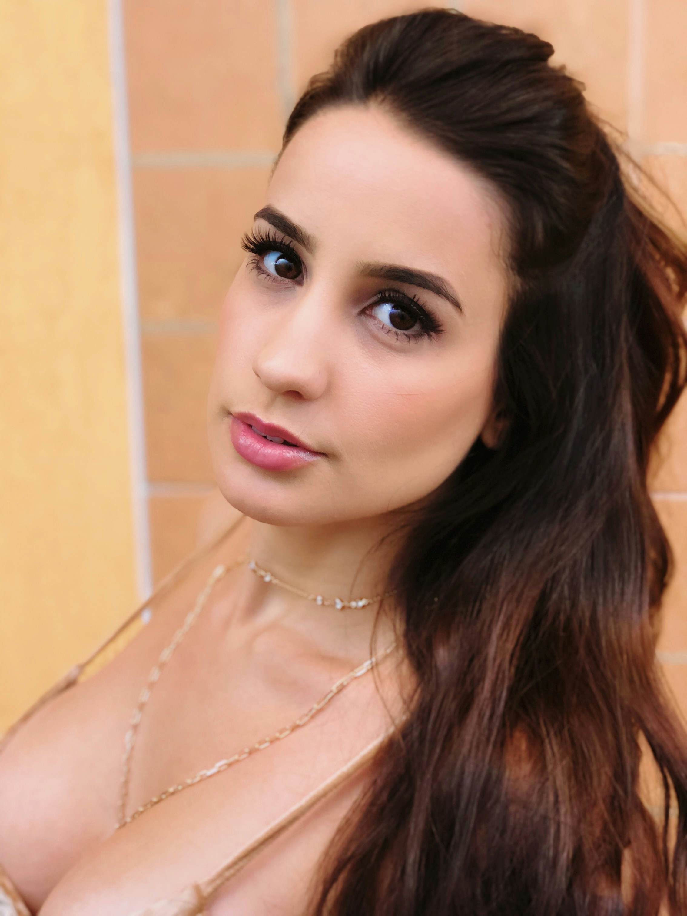 a woman with very big breast posing for a picture