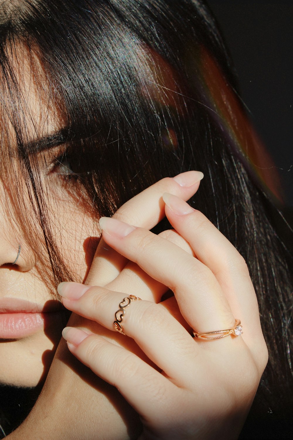 a close up of a person with a ring on their finger