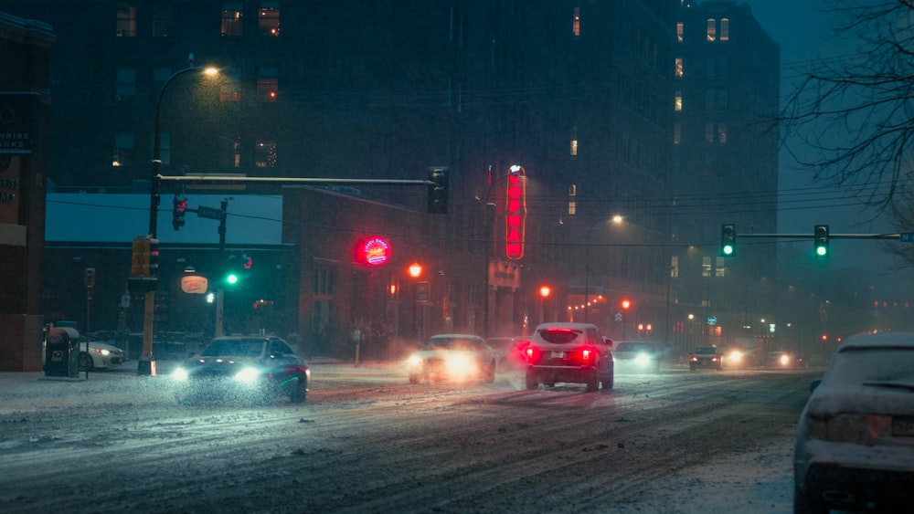 a city street filled with lots of traffic at night