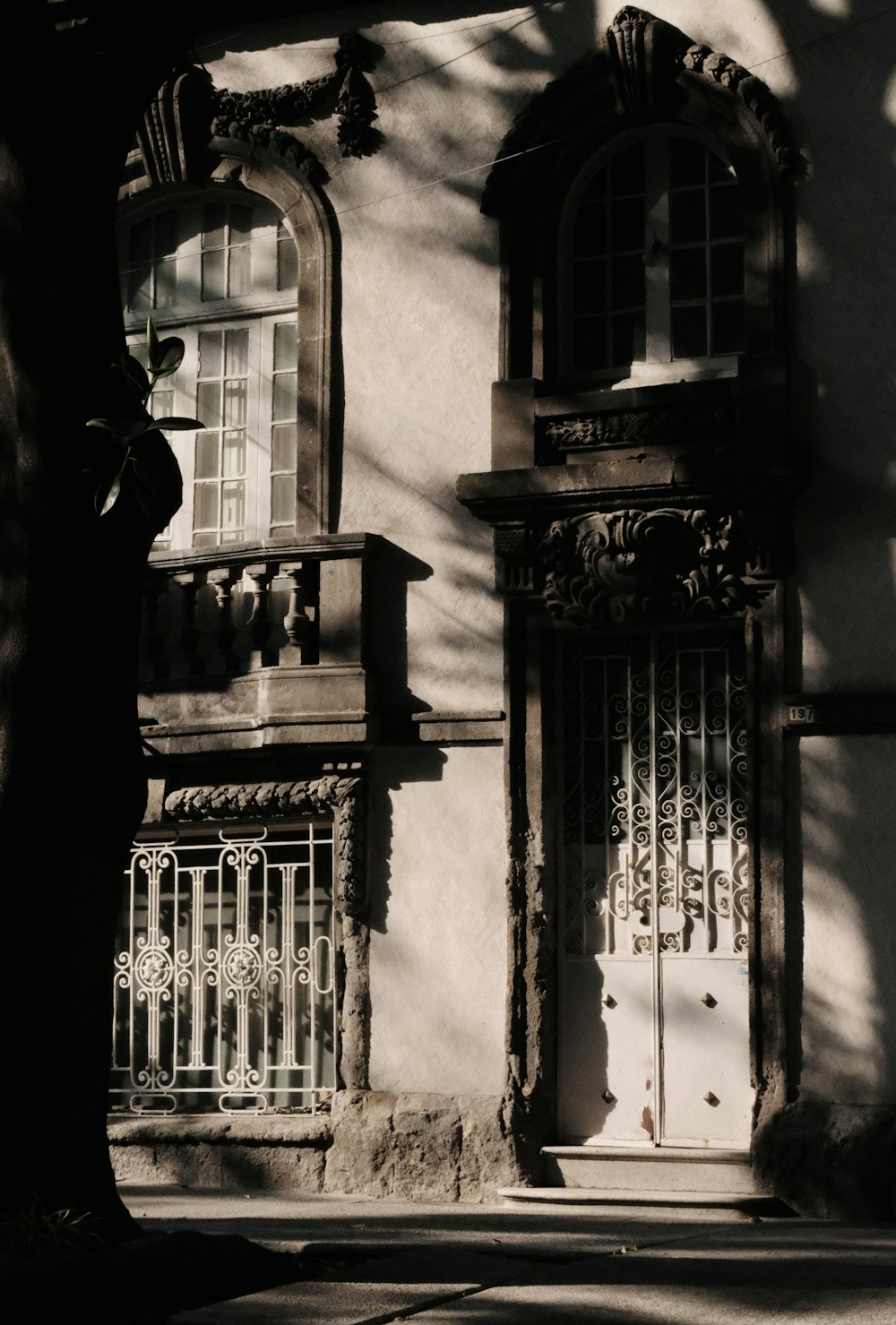 an old building with a white door and window