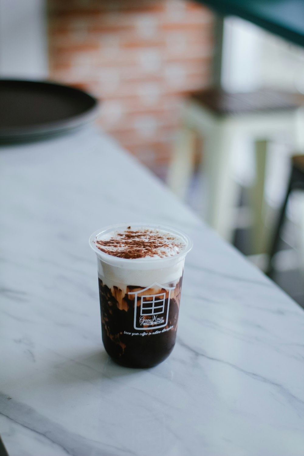 a cup of coffee sitting on top of a table