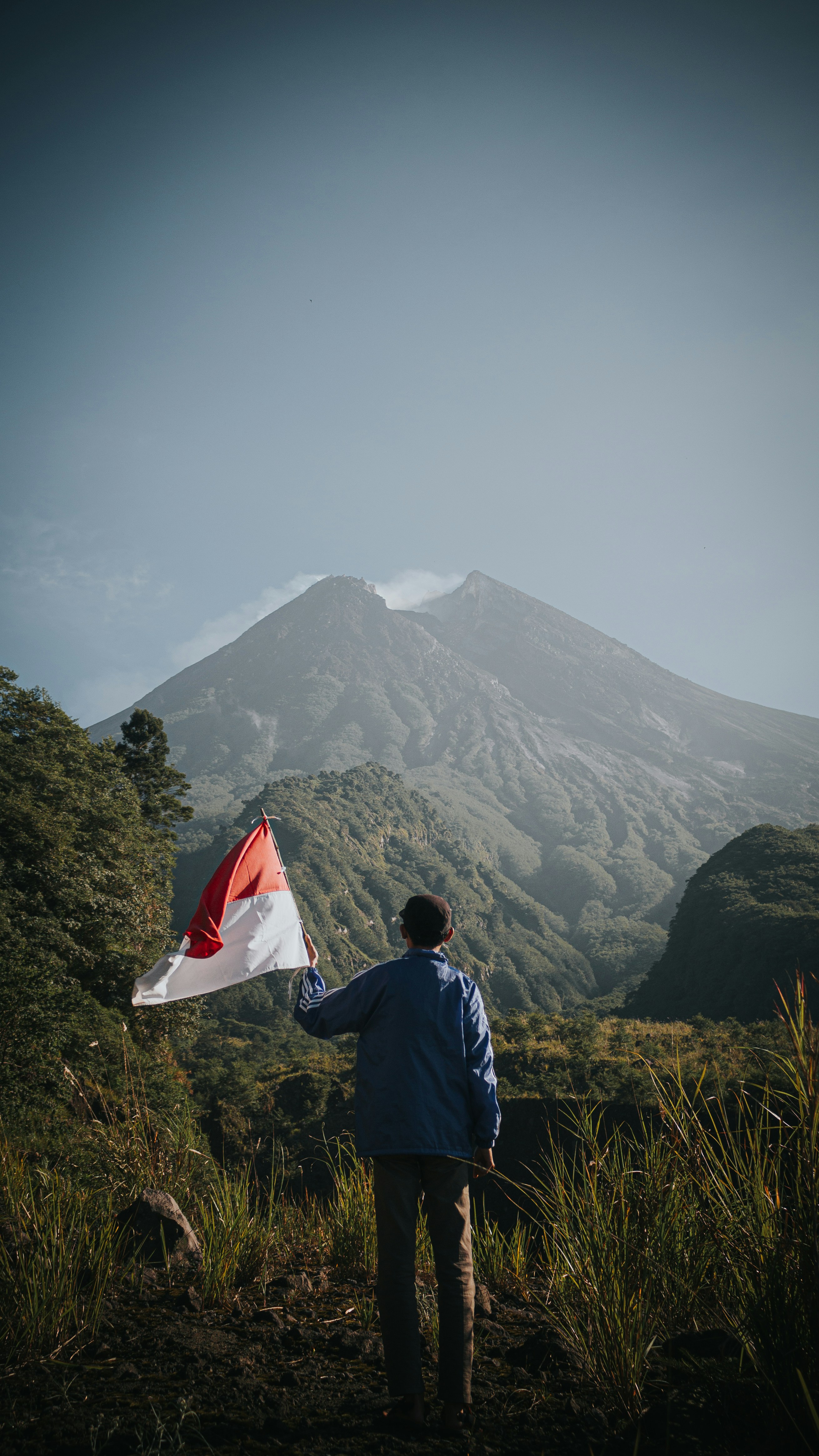 Nickel mining protest with man holding flag