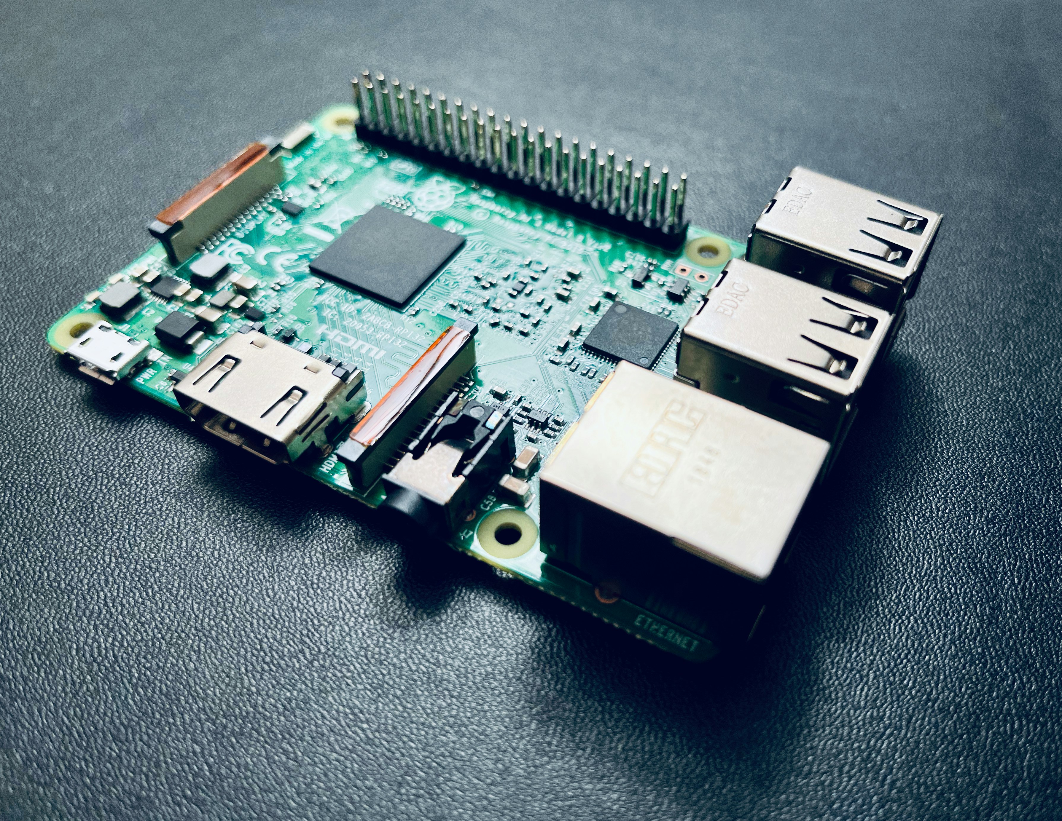 a close up of a computer motherboard with some wires attached to it