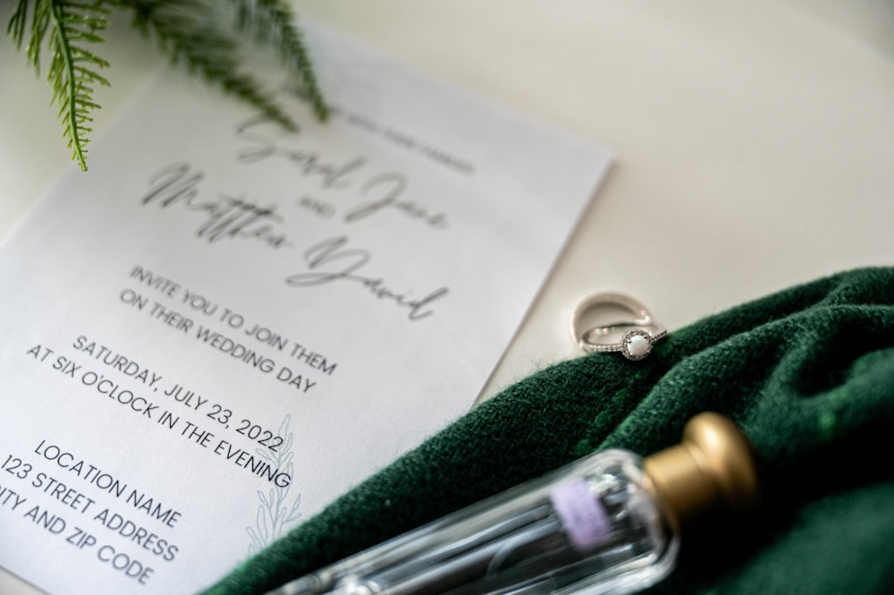 a close up of a wedding ring on top of a green cloth