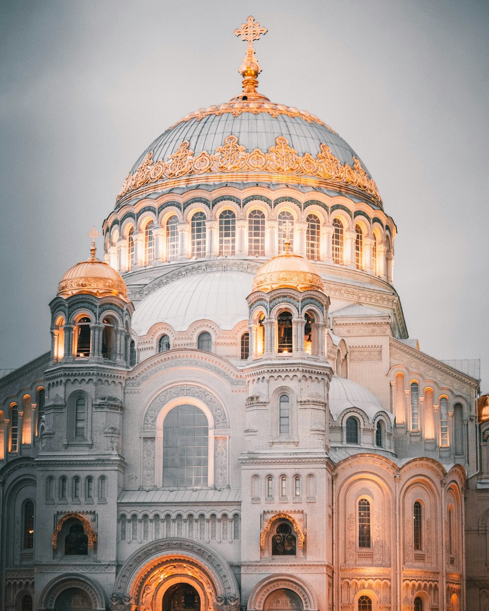 a large white building with a golden dome