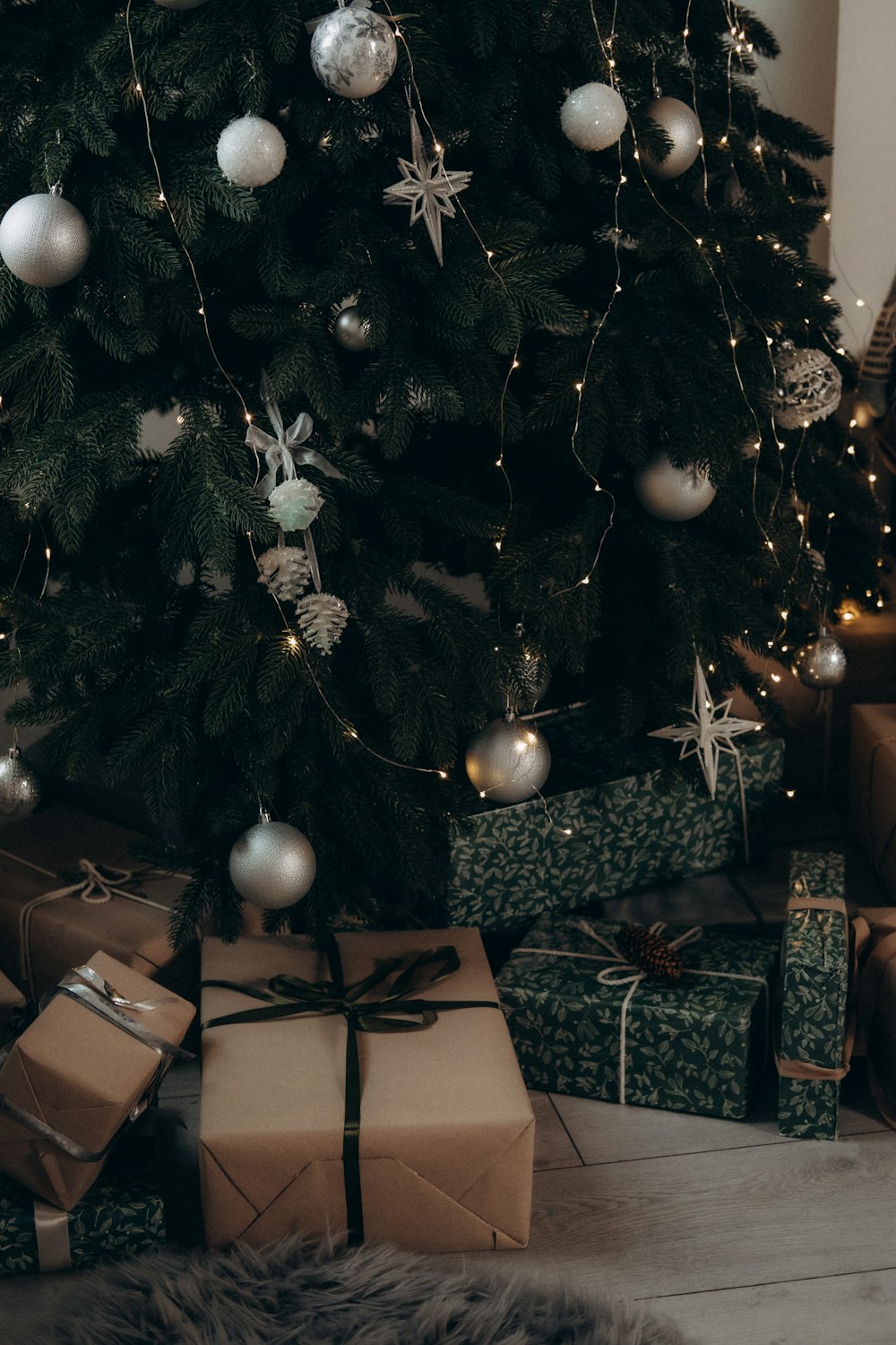 a christmas tree with presents under it