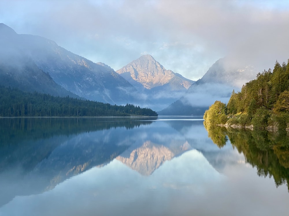 a lake with mountains in the background