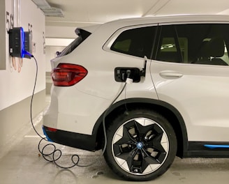 an electric car plugged in to a charging station