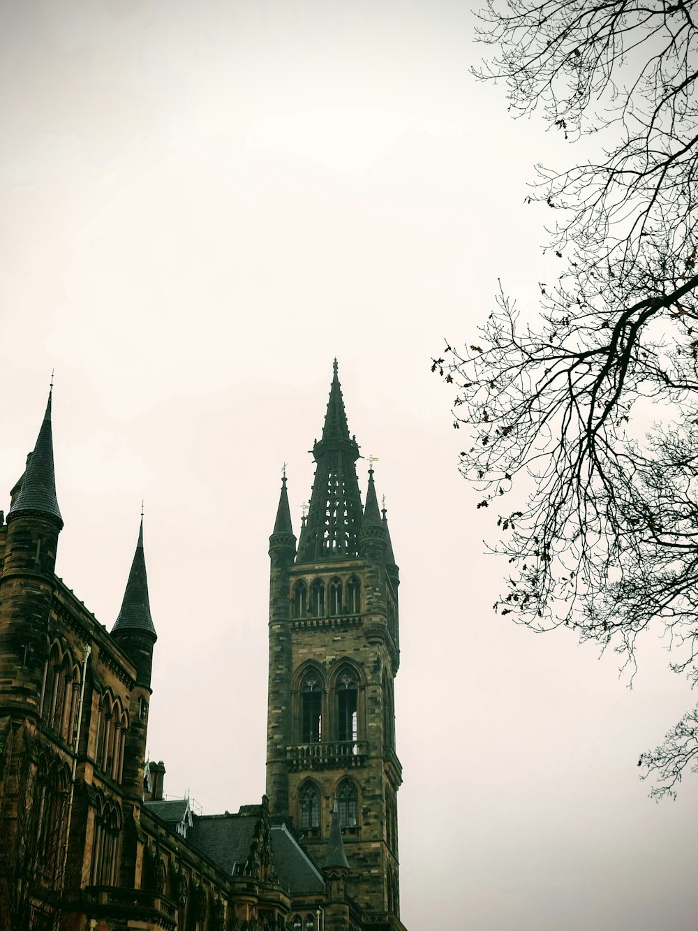 a tall tower with a clock on the top of it