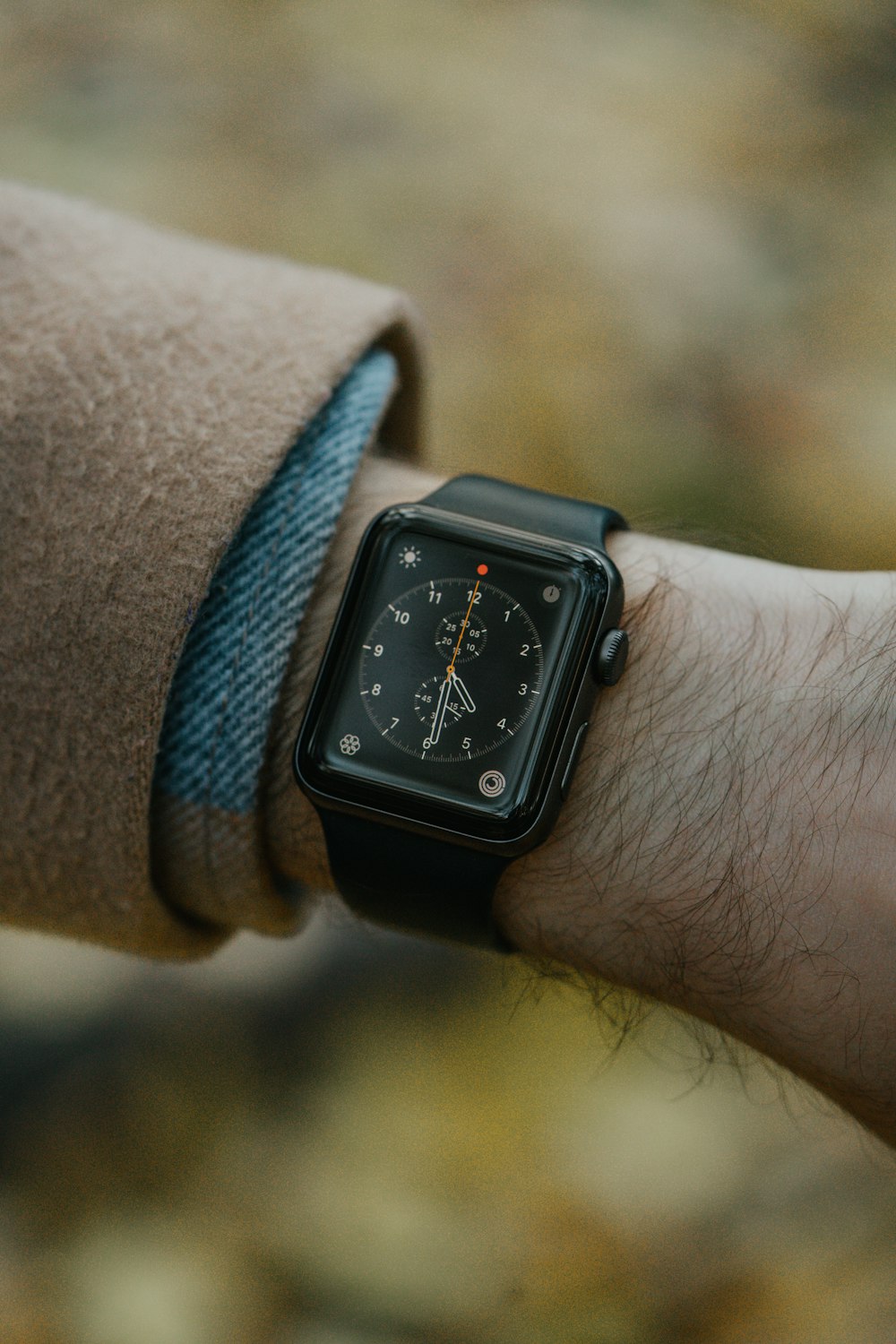 a close up of a person wearing a watch