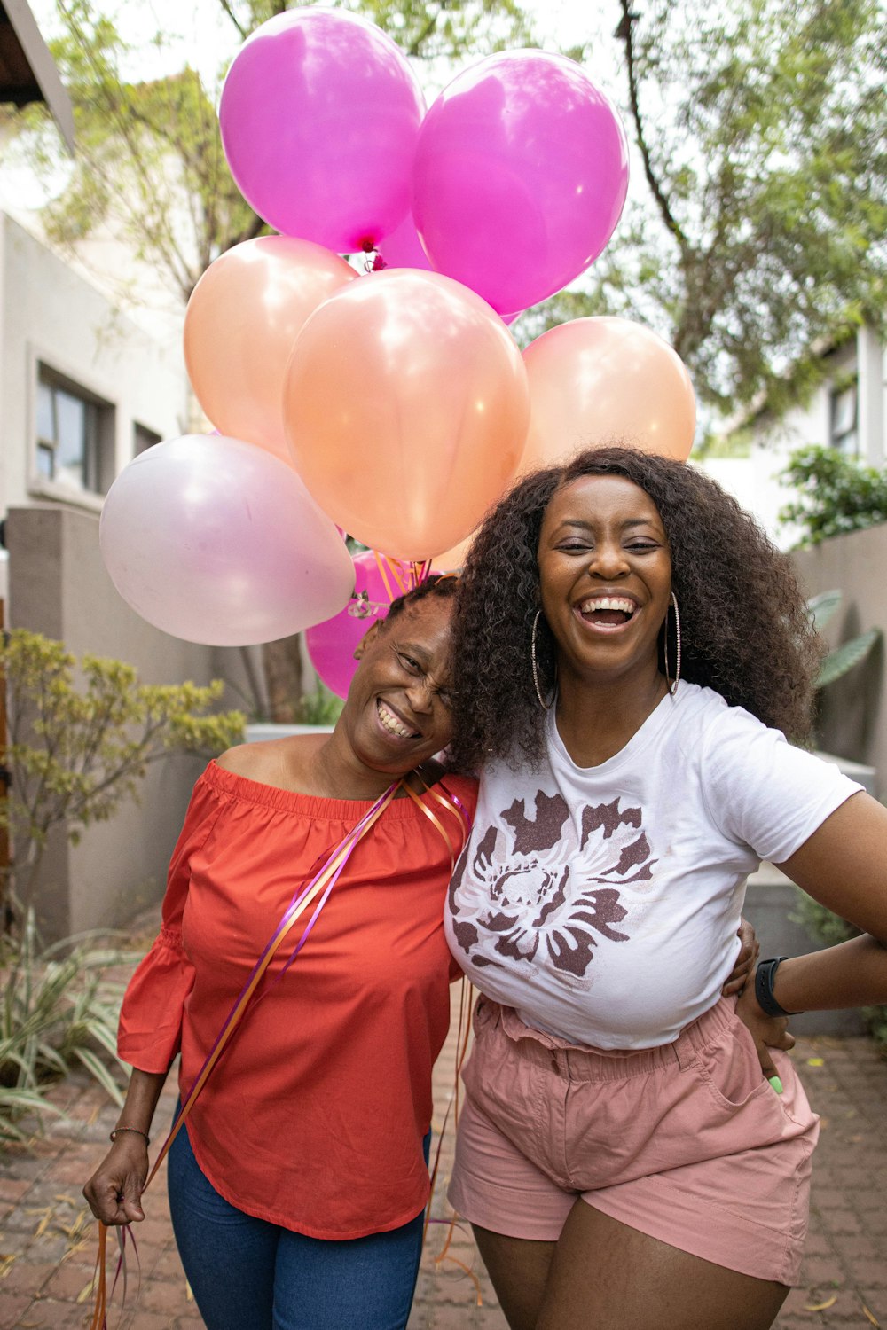 a couple of women standing next to each other