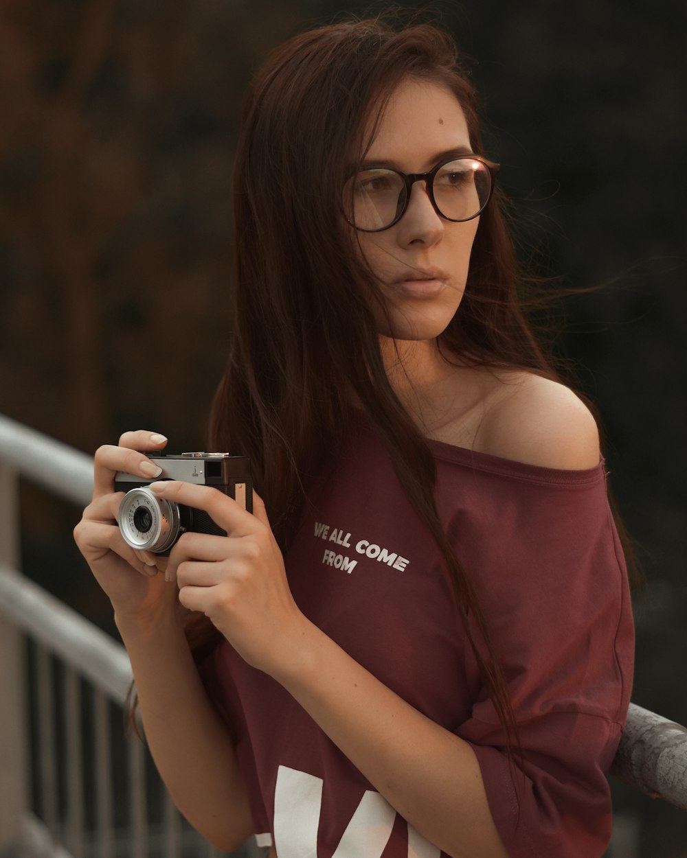 a woman holding a camera