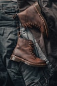 Stylish boots for men displayed against a rustic background.