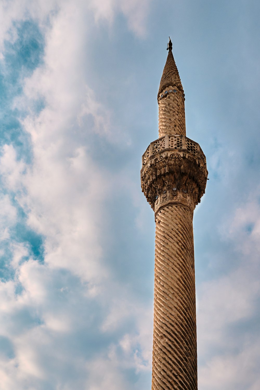 a tall stone tower with a sky background