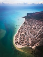 an aerial view of a small town on a beach