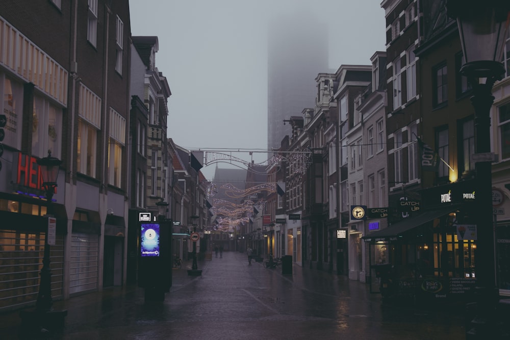 a city street in the middle of a foggy day