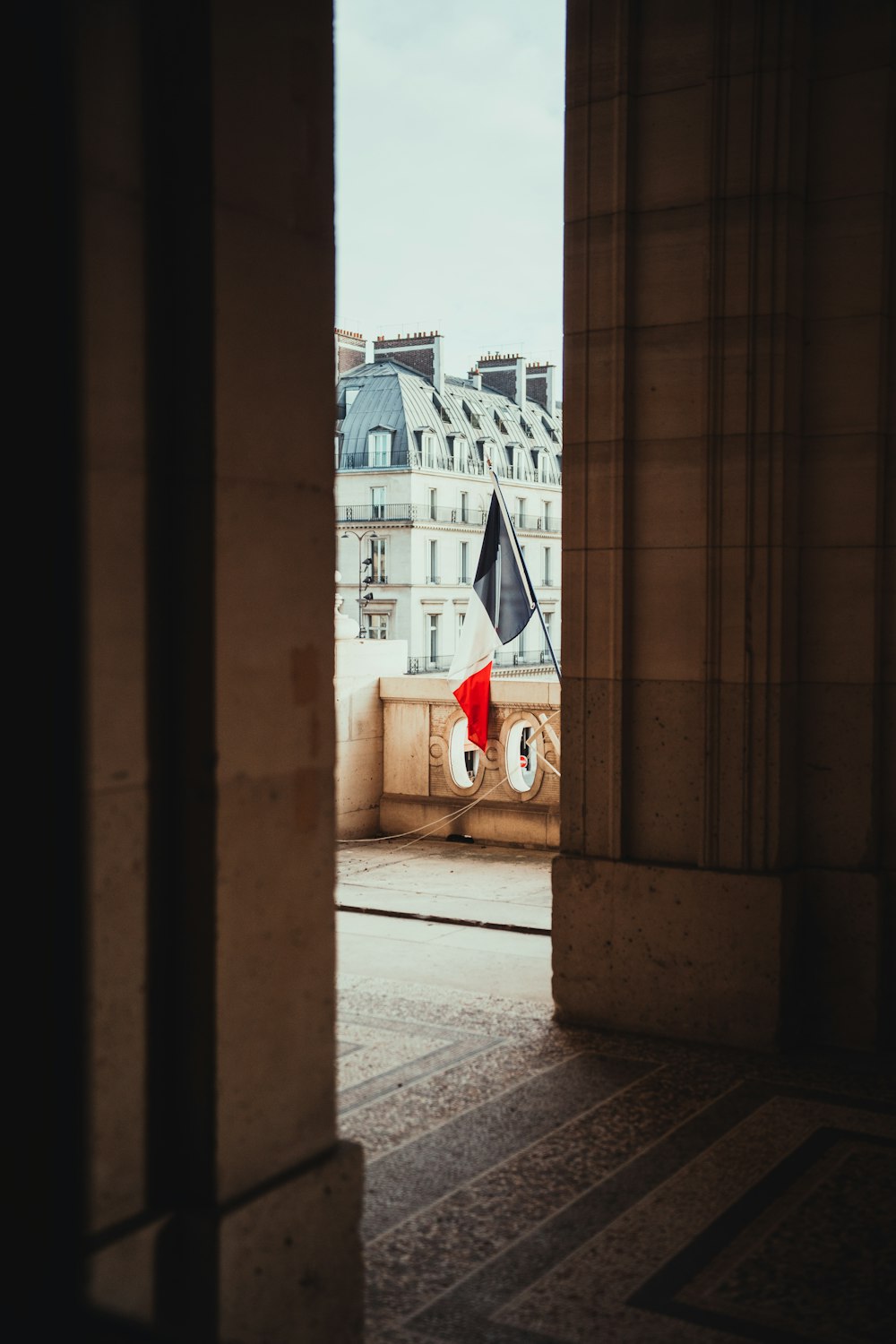 a red umbrella sitting in the middle of a building