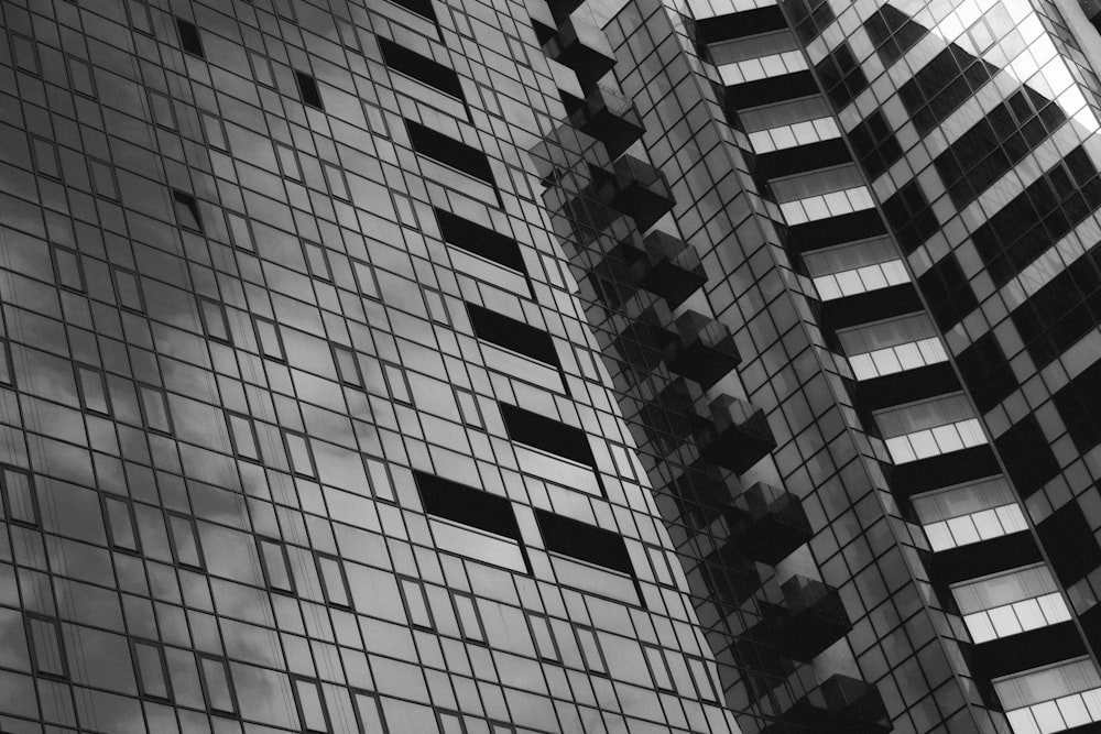 a black and white photo of two tall buildings