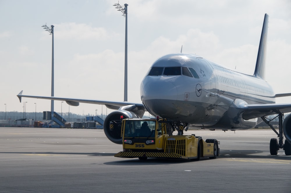 a large jetliner sitting on top of an airport tarmac