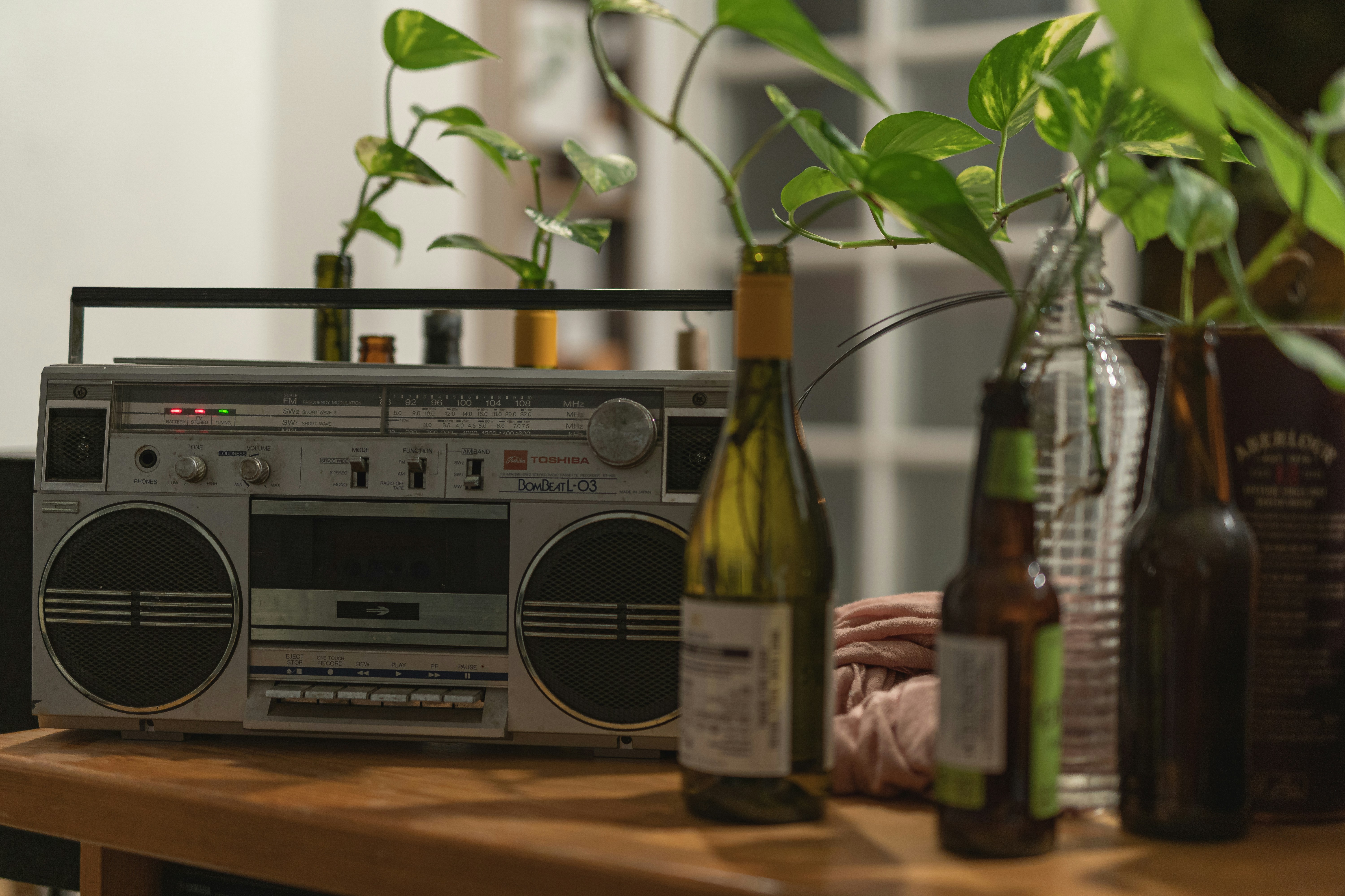 a table topped with bottles of wine and a radio